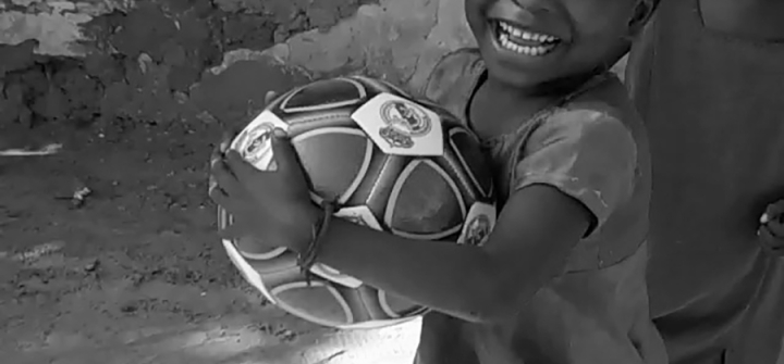 Boy with soccer ball in Kenya
