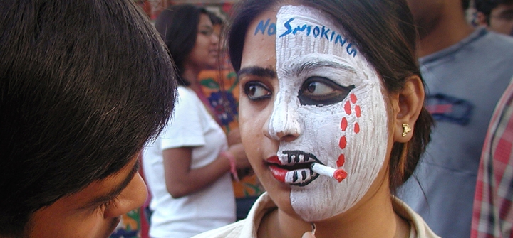 A young woman protests tobacco with face paint during a campaign to prevent cigarette smoking in India. 