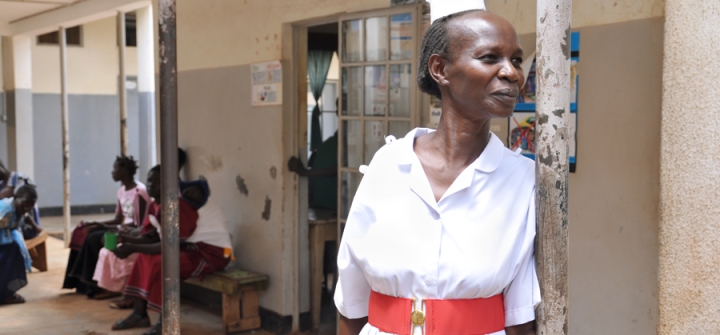Mary Philomena Okello, clinical palliative nursing officer at Lira Regional Referral Hospital in Lira, Uganda, stands outside the ward. 