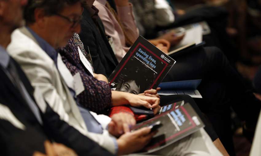 Audience members peruse a new WHO report on NCDs at its May 20 release in Geneva. (Image: Courtesy of Bloomberg Philanthropies)