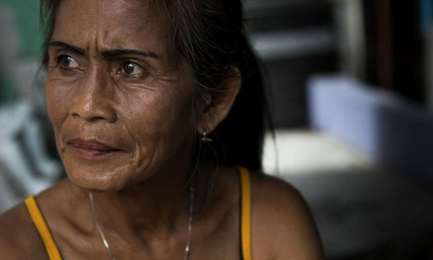 Carmelita Bajacan, 60, lost her 37-year-old son, Irish, in an anti-drug raid. Image by Amanda Mustard for Global Health NOW.