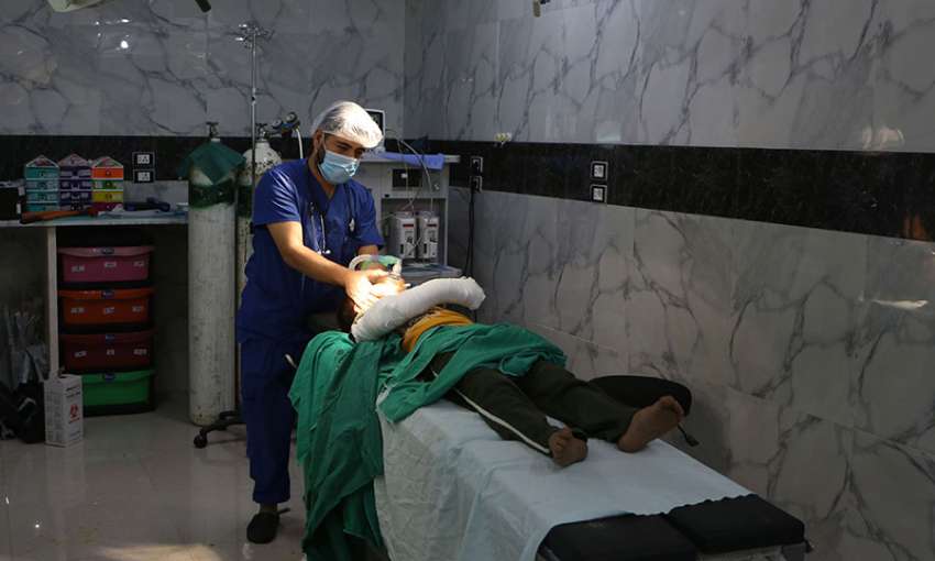 A Syrian doctor checks on a child after a surgery at a hospital in Syria's Idlib province, September 10, 2018. Image: Aaref WATAD/AFP/Getty