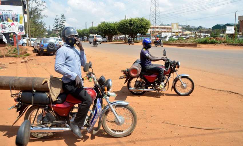 Motorcyclists carry oxygen cylinders in Kampala, Uganda, June 13, 2021. Image: Nicholas Kajoba/Xinhua via Getty