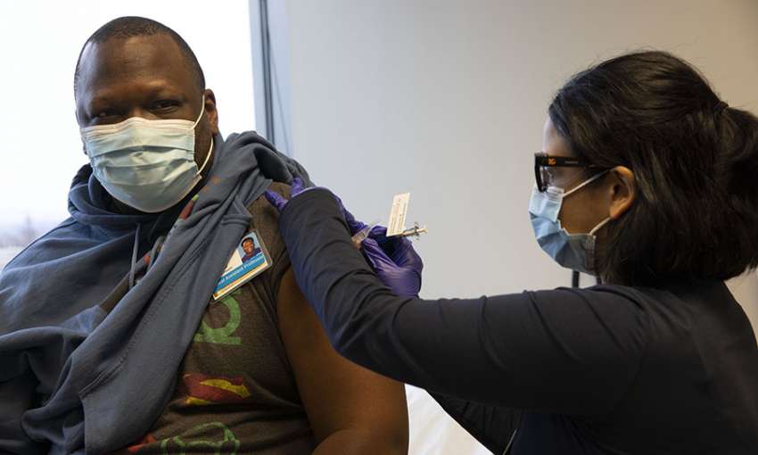 Stephaun Wallace receives a Novavax Covid-19 jab in a phase 3 clinical trial at the U. Washington Virology Research Clinic in Seattle. February 12, 2021. Image: Karen Ducey/Getty