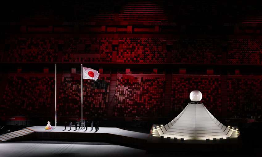 Athletes raise the Japanese flag at the Olympics Opening Ceremony. Tokyo, July 23, 2021. Image: Jan Woitas/picture alliance/Getty