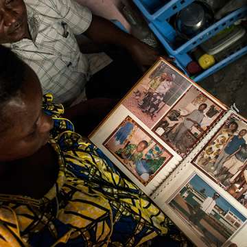 Gaby Ngabu Kasongo and Grace Neema Bandole looking through their engagement photos