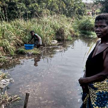 Women in DRC soaking cassava