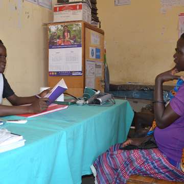 Caroline Akello attending to a mother at Loktelabu Health Centre III, Uganda. 