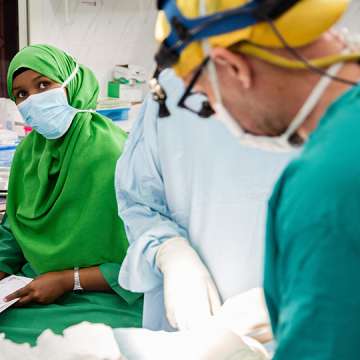 Hamda Mohamed Omar (left), a nurse anesthetist/trainer from Edna Adan hospital in Hargeisa, at work with a visiting surgeon. 