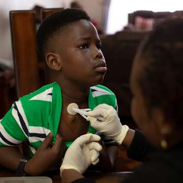 Ethan Miruka, 10, receives blood clotting medicine every 48 hours, a procedure that his mother carries out in their family home. It allows him to carry on a normal life.