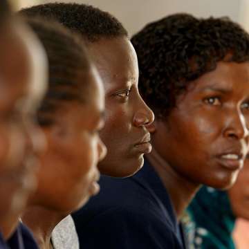 Woman attending cervical cancer educational meeting in Kenya