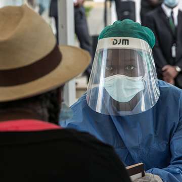A health care worker tests for COVID-19 yesterday in Antananarivo, Madagascar. Photo by RIJASOLO/AFP via Getty Images