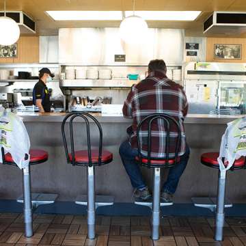 Seats are marked off for social distancing at a Waffle House in Brookhaven, Georgia on April 27, 2020. Image: Jessica McGowan/Getty