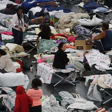 People take shelter after flood waters from Hurricane Harvey inundated Houston, Texas. August 29, 2017. Image: Joe Raedle/Getty