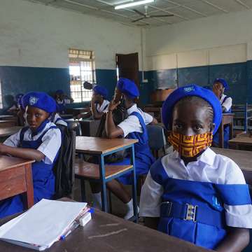 A young student wears a face mask on her first day back at her Freetown, Sierra Leone secondary school on October 5, 2020. Image: SAIDU BAH/AFP via Getty Images