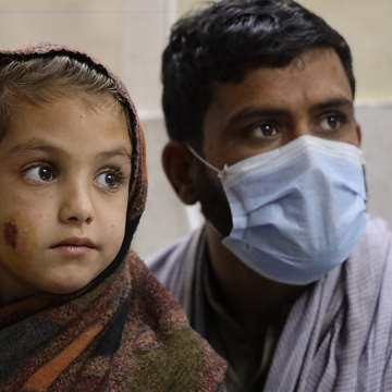 A young girl is at MSF’s cutaneous leishmaniasis treatment center with her uncle at Naseerullah Khan Babar memorial hospital, Peshawar. Nov. 1, 2020 Image by Nasir Ghafoor/Courtesy of MSF 