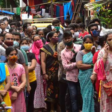 People queue up yesterday to get a COVID-19 jab in Worli village in Mumbai, India. Image: Anshuman Poyrekar/Hindustan Times via Getty Images