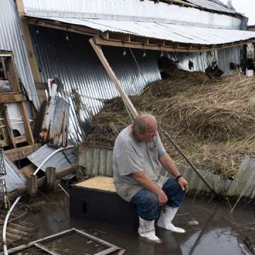 A residents watches as debris is cleared from his boat dock after Hurricane Ida. Cocodrie, Louisiana. September 1, 2021. Image: Mark Felix/Bloomberg/Getty