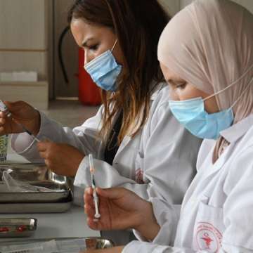 Medical workers prep a COVID-19 vaccination center in Tunis, Tunisia. Sept. 4, 2021. Image: Adel Ezzine/Xinhua via Getty