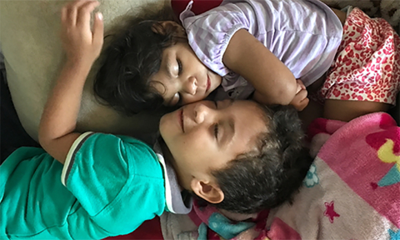 Jorge, 4, scrambles onto the couch to curl up next to his sister, Valentina. He follows her around, oozing with big-brother love and showering her with snuggles, kisses, and hugs. His adoration is heartwarming in its sincerity. Though caring for Valentina takes up much of Dhulha’s energy and time, she says that “Jorge is crazy about his sister, not jealous.”