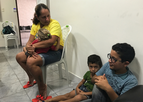 Josimary Gomes da Silva, 36, waits with 3 of her children for her son’s physical therapy appointment at a specialized microcephaly and congenital Zika syndrome clinic in Campina Grande, Paraíba.