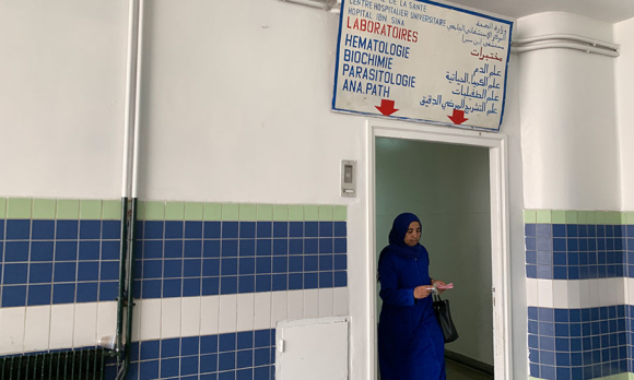 A woman walks out of the hematology laboratory in Hôpital Ibn Sina, a public hospital in Rabat and office of doctor and feminist Asma Lamrabet. While Lamrabet does not perform virginity tests, private clinics and hospitals are often visited by women to obtain virginity certificates. Image by Samidha Sane.