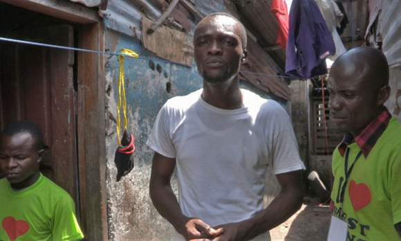 Archie C. Gbessay meets with community contact tracers in West Point during the 2014-2016 Ebola outbreak. Monrovia, Liberia. September 2014. Image: M. Holden Warren